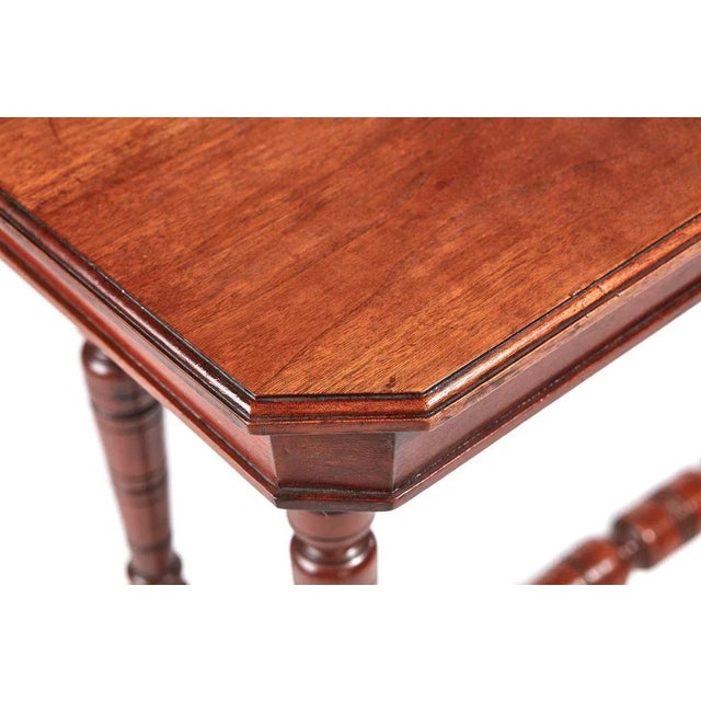 Victorian antique centre table having a pretty solid walnut top with walnut frieze. Supported by four elegant turned...