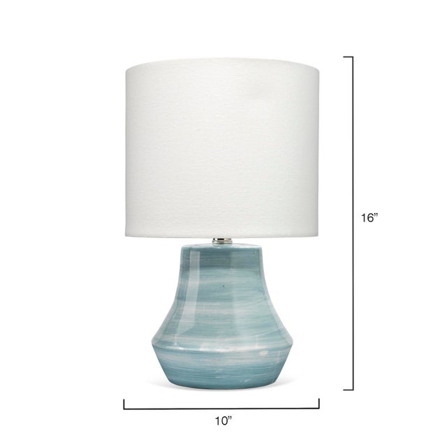 The handcrafted ceramic lamps in the Cottage collection are adorned with easy, airy swirls color. They are available in...