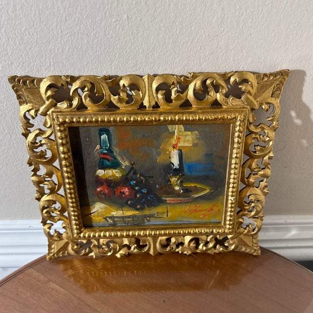 Beautiful vintage Italian still life painting featuring a classic composition of fruit, wine bottle, and table setting....