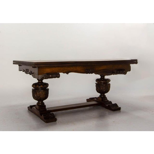 Spanish-style carved oak dining table, 1950s–1960s A Spanish-style oak dining table dating from the 1950s–1960s, featuring...