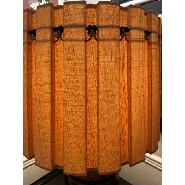 Our vintage Chinoiserie toleware tea canister lamp topped with a textured pleated lampshade is massive and gorgeous! The...