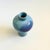 A vintage ceramic vase with a lovely blue and purple glaze.