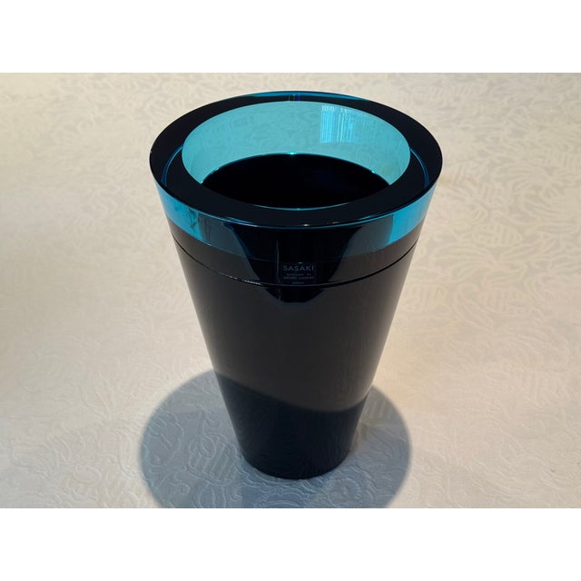 This postmodern vase by world famous Japanese glassware designer Soichiro Sasakura features the sleek, tapered shape,...