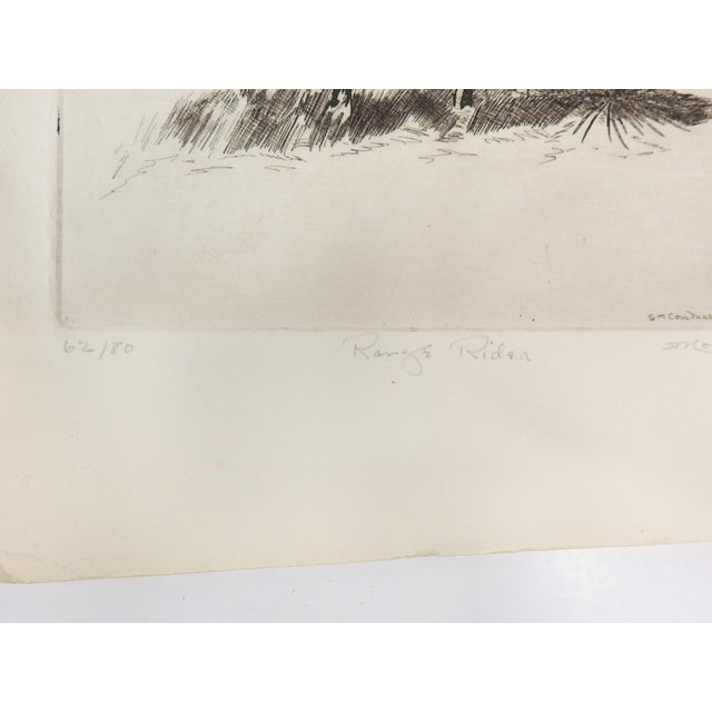 1973 etching on paper of cowboy on horseback by Steve Coulthard (1931–2011) Wyoming. Signed, titled Range Rider and...