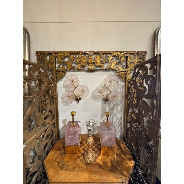 This product is a pair of beautiful Murano pink flower wall sconces, adding a touch of elegance and charm to any room. The...