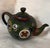 Highly detailed Meiji Period antique Japanese cloisonné teapot with lid. This miniature work of art has a floral medallion...