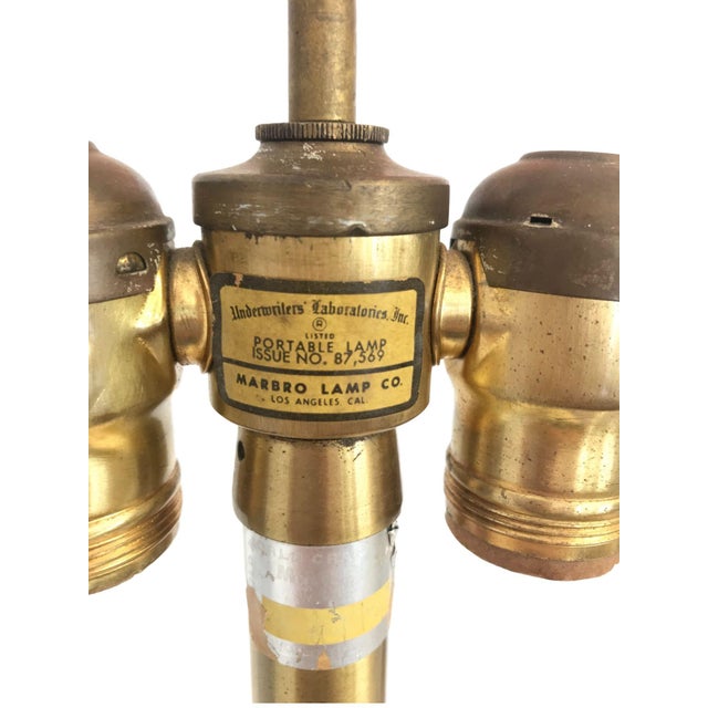 Pair of vintage Marbro ceramic Chinoiserie lamps from circa 1940s. Features hand-painted floral designs on a pale yellow...