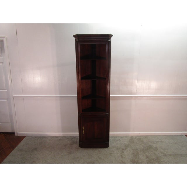 Item: Statton solid cherry corner bookcase. Age: 1980's. Details: Raised panel door and the Old Towne finish....