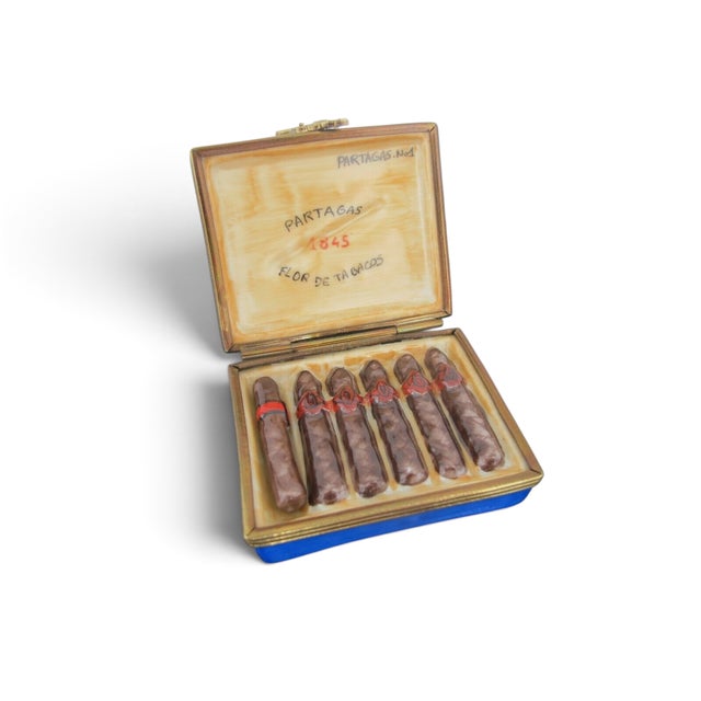 Hand Painted French Limoges porcelain trinket box shaped like a Partagas Cuban Cigar Box featuring a removable cigar piece...
