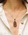 Vintage Bohemian garnet pendant in gilt silver. Drop or pear-shaped pendant, with a three-level openwork design, set with...