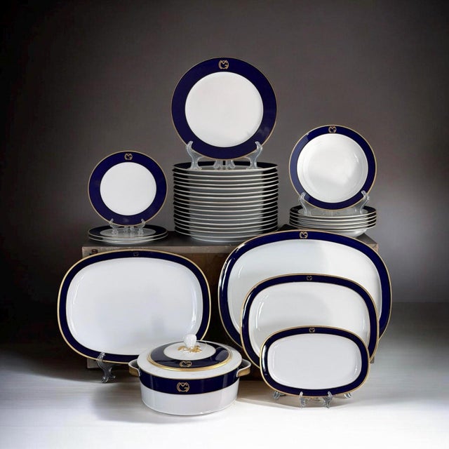 Elegant and highly distinctive Swiss porcelain dinner service by Suisse Langenthal, dated 1978. This refined set features...