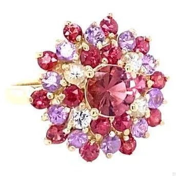 This Ring has a pretty Round Cut Tourmaline in the center that weighs 0.87 Carats. The Tourmaline is surrounded by 30...