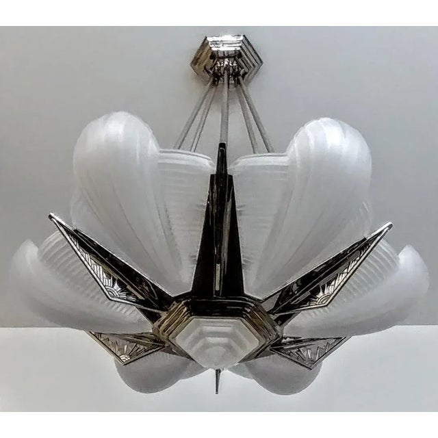 A French Art Deco pendant chandelier by the French artist "Petitot" in excellent condition. Six shades with hexagonal...