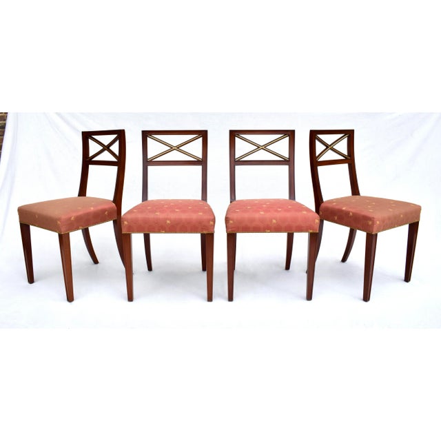 Set of six solid Mahogany parcel gilt X back dining chairs with distinct design elements as seen in the works of Thomas...