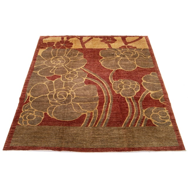 Modern Pakistani Peshawar Rug – Hand-knotted in wool, this artistic piece features bold, stylized floral motifs in golden...