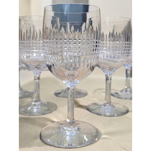 Six cut crystal water glasses from the renowned baccarat crystalworks, in the nancy pattern. Created in 1867, this iconic...