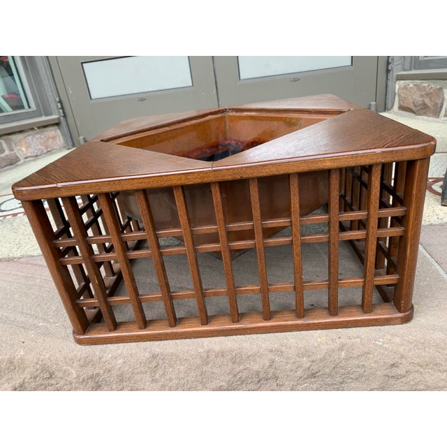 This beautiful indoor mid 20th century plant stand is oak with a lattice design and has original copper triangular shaped...