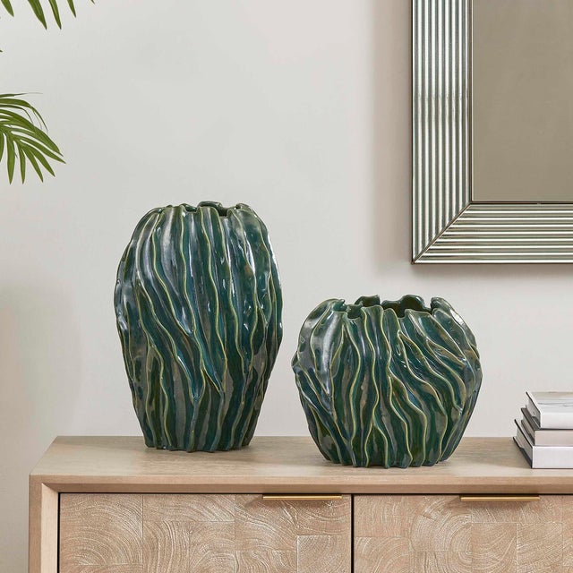 This Pair Of Ceramic Vases Features A Unique, Flowing Form With An Organic, Swirled Texture. A Rich, Deep Glaze In Varying...