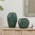 This Pair Of Ceramic Vases Features A Unique, Flowing Form With An Organic, Swirled Texture. A Rich, Deep Glaze In Varying...