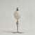 Whimsical yet sophisticated pair of candlesticks having a surprising composition with ostrich eggs held by frogs supported...