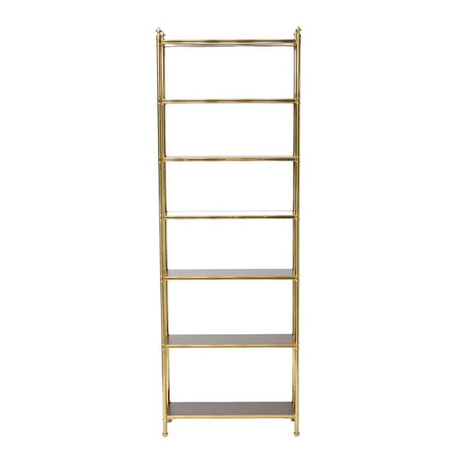 A striking blend of elegance and utility, this tall and narrow Billy Baldwin style étagère with seven shelves is a refined...