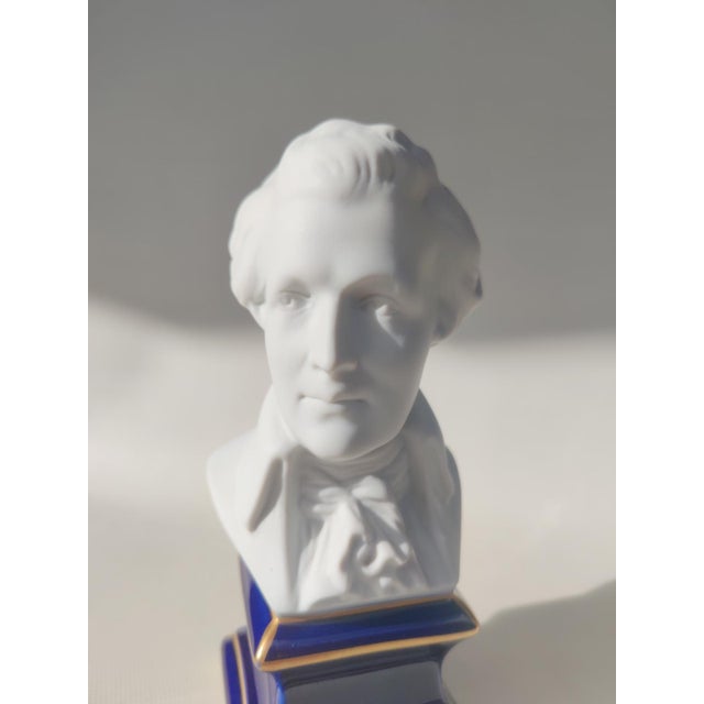 Biscuit Porcelain Bust of Mozart, by Tharaud Limoges. Biscuit porcelain bust on a cobalt blue porcelain base with gilt...