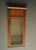 A large Dutch oak wall mirror with text in Dutch that translates as "There is no place like home". Its style is Nieuwe...