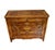 A chest of drawers complete with three large front drawers and an inlaid wood top. The sides of the cabinet feature...
