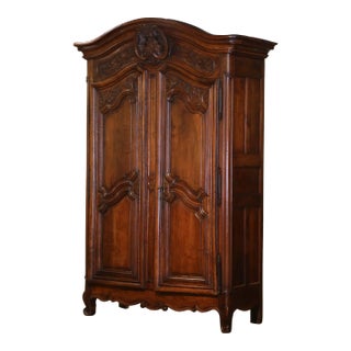 18th Century French Louis XV Carved Walnut Armoire Lyonnaise With Floral Motifs For Sale