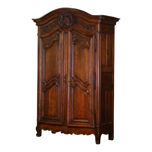 18th Century French Louis XV Carved Walnut Armoire Lyonnaise With Floral Motifs For Sale