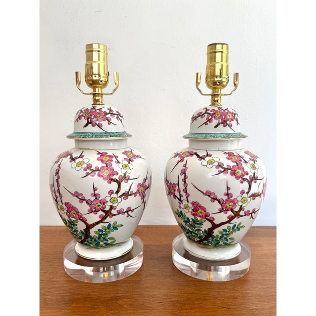 Pretty pair of temple jars with the traditional plum blossom motif recently converted into modern table lamps with clear...