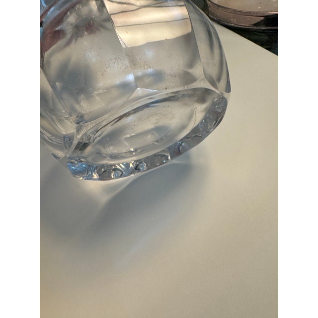 Cut glass heavy weight decanter with silver rim in good condition. There is some residue in the interior that needs to be...