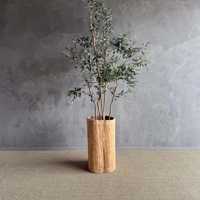 This unique planter brings a touch of rustic charm and natural beauty to any outdoor space. The weathered wood and natural...