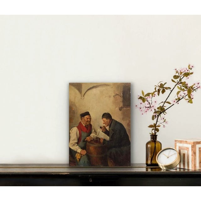 An attractive genre scene oil on panel depicting two German men engaged in conversation about the newspaper by Hedwig...