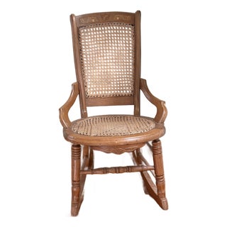 Early 1900s Colonial Revival Cane Rocking Chair With Burlwood Crest Inlay | Traditional Americana Rocker For Sale