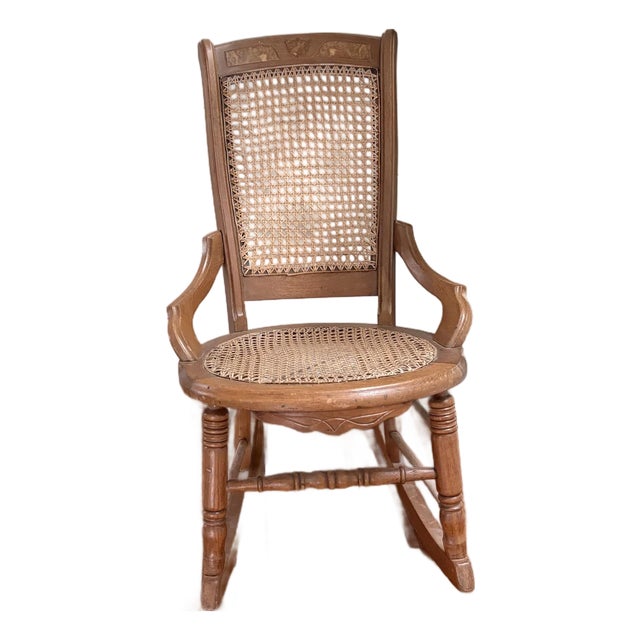 Early 1900s Colonial Revival Cane Rocking Chair With Burlwood Crest Inlay | Traditional Americana Rocker For Sale