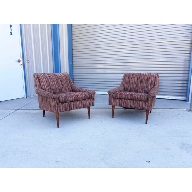 ✨ Pair of Mid-Century Walnut Lounge Chairs, 1960s ✨ This stunning pair of mid-century lounge chairs, expertly crafted in...