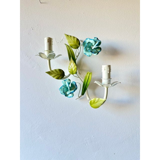 Matching Italian tole lighting set comprising a three-arm chandelier and a pair of two-light wall sconces. Hand-painted...