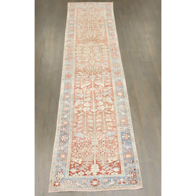 an early 20th century floral Persian Heriz runne