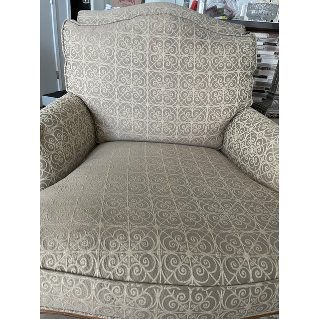 French XV Bergere over sized chair with custom upholstery. Upholstery is a light beige color with embroidered cream...