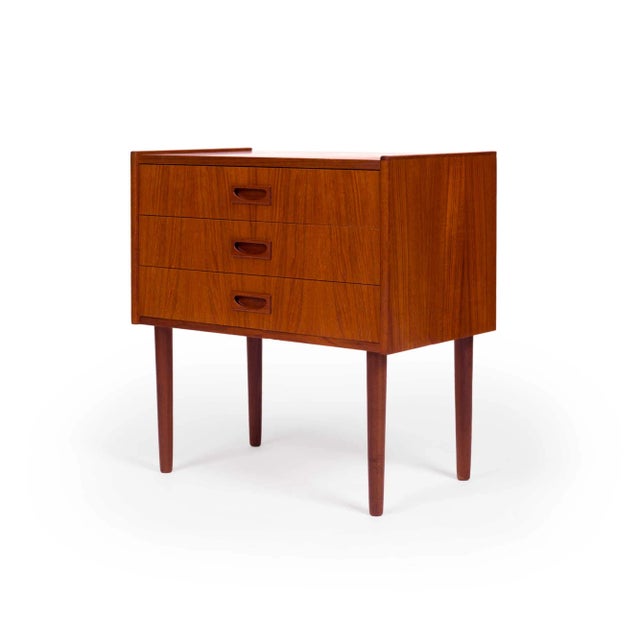 A vintage Danish teak chest with a beautiful teak grain. This small chest is a perfect size to be used as an accent or...