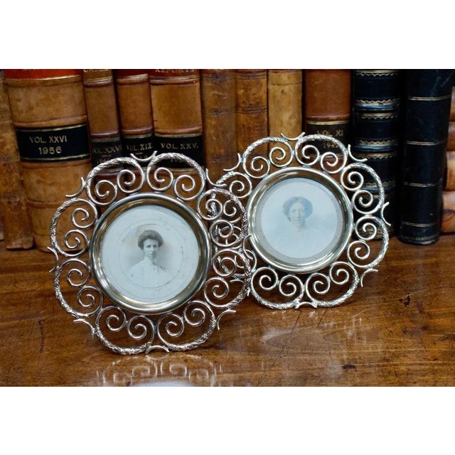 A pair of stunning antique English brass ring picture/photo frame with embossed floral details on each ring. These frames...