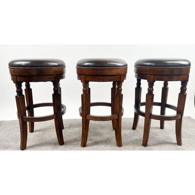 This set of three backless Frontgate bar stools blends classic sophistication with timeless durability. Each stool...