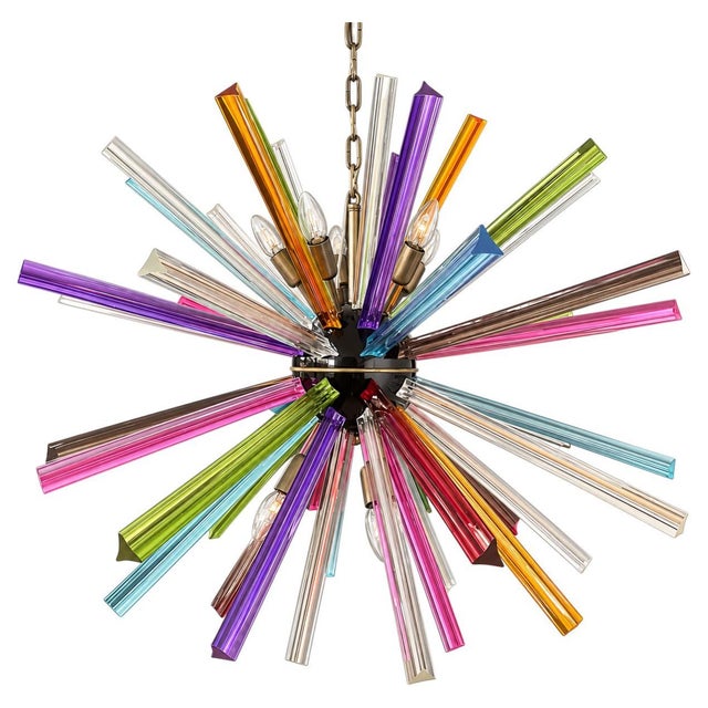 Italian Sputnik chandelier with 50 trihedral prisms in multicolored Murano glass. The glass elements radiate from a...