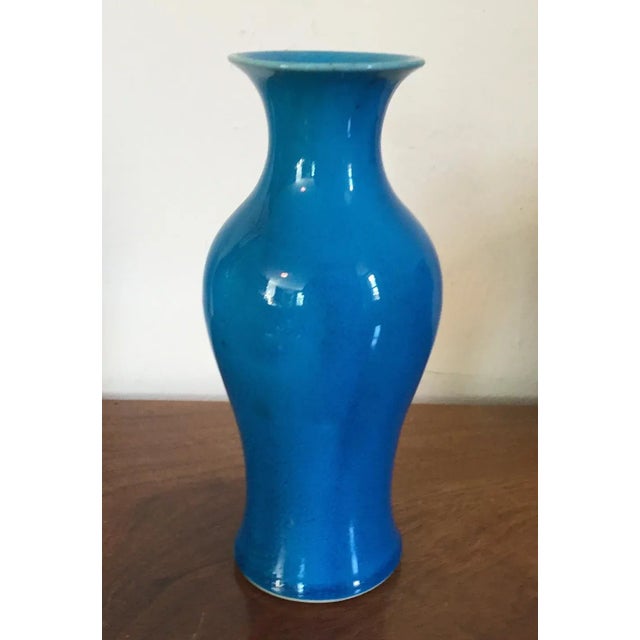 Antique Chinese monochrome porcelain baluster shape vase with bright peacock blue glaze. Measures 8" tall. Good condition.