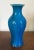 Antique Chinese monochrome porcelain baluster shape vase with bright peacock blue glaze. Measures 8" tall. Good condition.