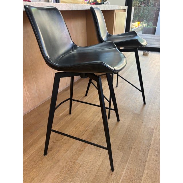 Authentic Arhaus swivel stools in lightly used condition. This listing includes a matching set of two Arhaus swivel...
