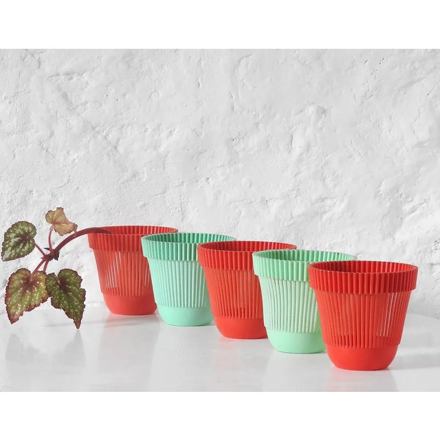 5 pieces (3 red, 2 pastel green), pleated plastic. For covering flower pots. Alkastap, France 1960s Height: 12 cm...