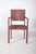 Armchair with fabric upholstery. Robust structure with straight lines and a simple finish, harking back to the functional...