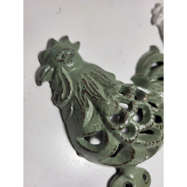 These cast iron wall fixture are country roosters. Industrial style with a French country design.